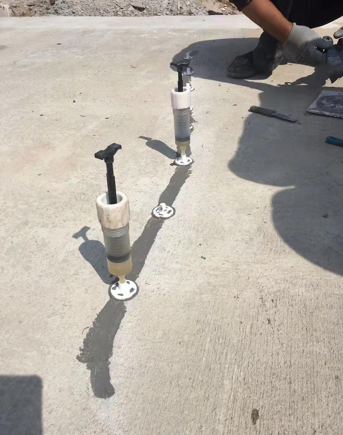 Bridge-maintenance-crew-conducting-crack-sealing-repair-on-concrete-deck