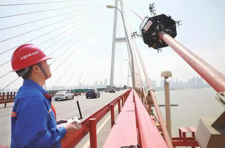 Drone Bridge Inspection vs. Cable-Climbing Robots – Riebo’s AI Drone Solution
