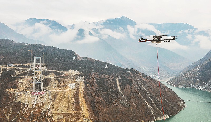 Drone-towing-pilot-cable-across-a-river